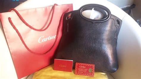 pochette marcello cartier catawiki